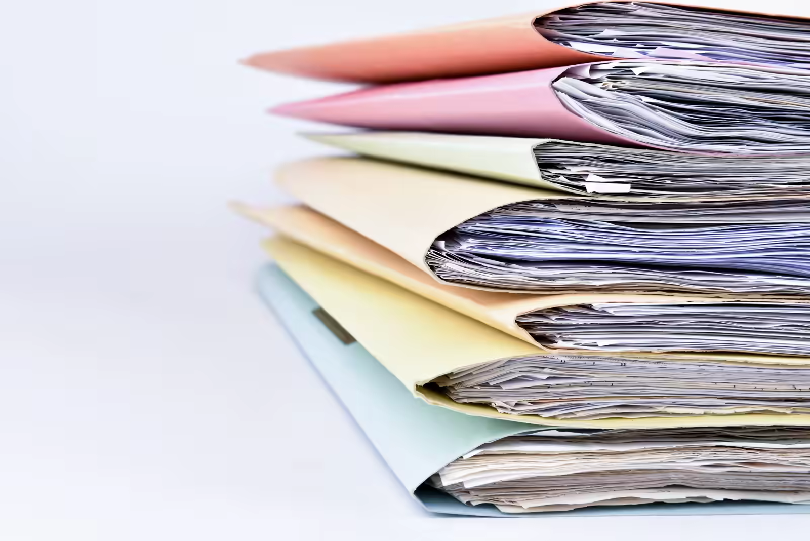 Healthcare compliance officer reviewing vendor credentialing documents and certificates