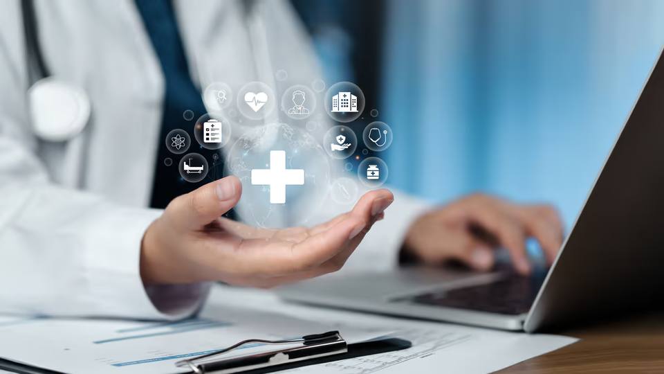 Developer reviewing FHIR API documentation on a laptop with healthcare system diagrams