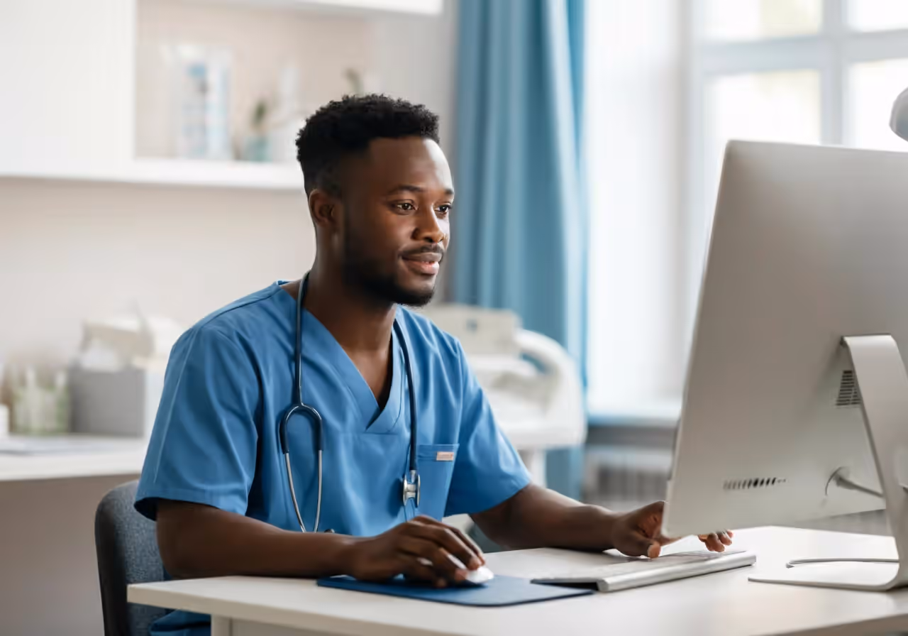 Healthcare administrator reviewing a Becker's Hospital Review report at a desk