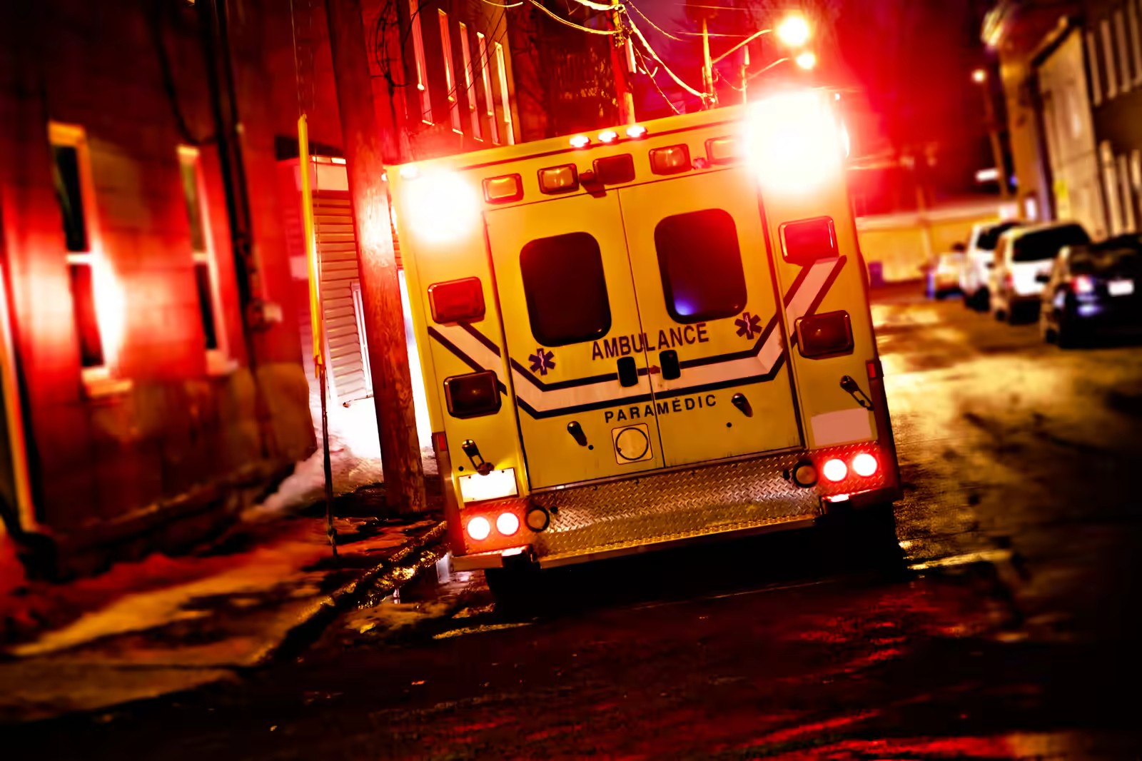 Ambulance parked outside an emergency department entrance at a hospital