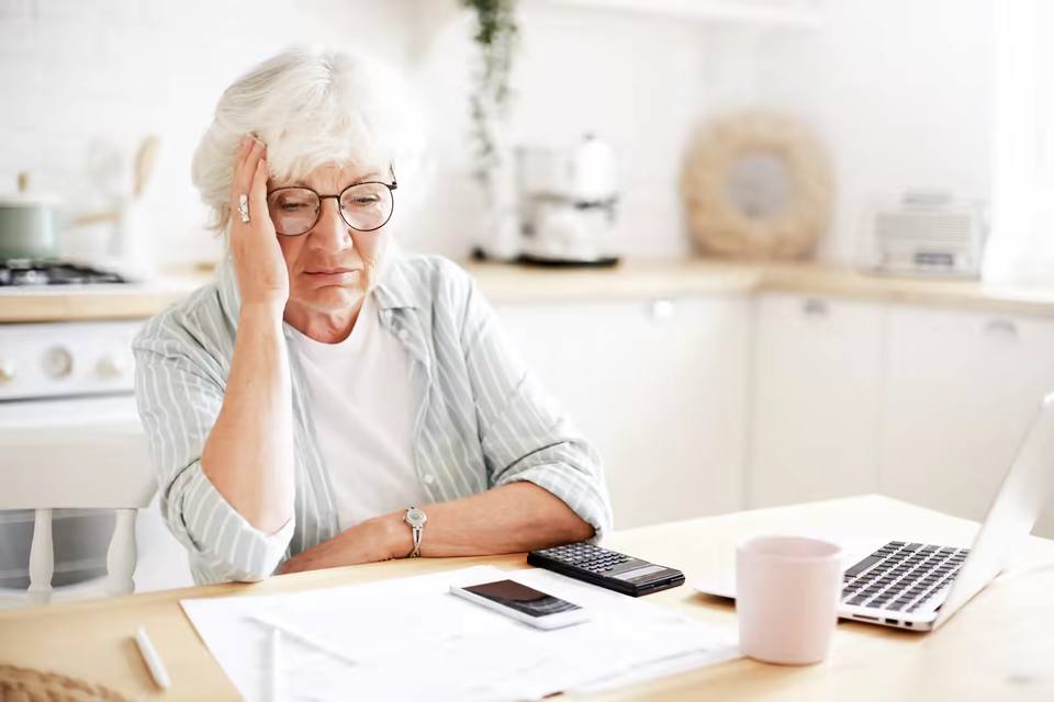 Patient reviewing a surprise ambulance bill with a look of concern