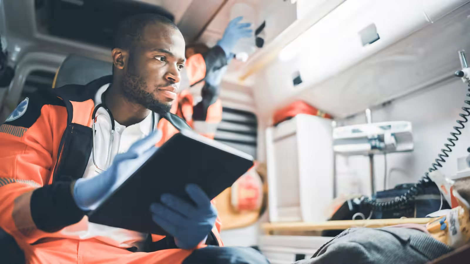 Orange County healthcare worker coordinating mental health transport on a mobile device