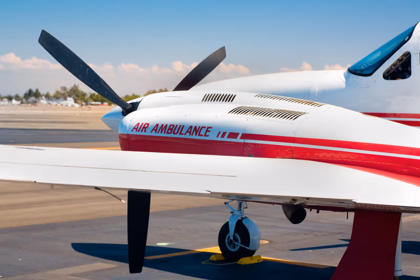 Fixed-wing air ambulance aircraft on a tarmac ready for patient transport
